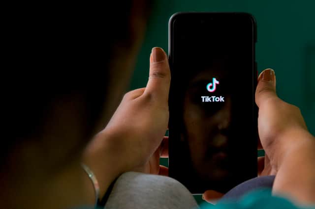 A mobile user browses through the Chinese owned video-sharing TikTok app on a smartphone (Photo: MANJUNATH KIRAN/AFP via Getty Images)