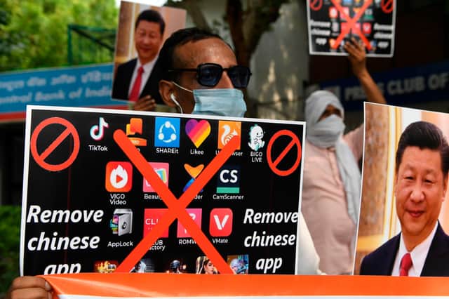 Members of the Working Journalist of India (WJI) hold placards urging citizens to remove Chinese apps and stop using Chinese products during a demonstration against the Chinese newspaper Global Times in June 2020 (Photo: PRAKASH SINGH/AFP via Getty Images)