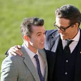 Co-Owners of Wrexham AFC Rob McElhenney (L) and Ryan Reynolds (R) at the club’s Racecourse ground in December 2022 (Photo: Christopher Furlong/Getty Images)