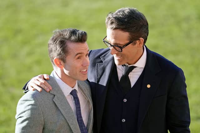 Co-Owners of Wrexham AFC Rob McElhenney (L) and Ryan Reynolds (R) at the club’s Racecourse ground in December 2022 (Photo: Christopher Furlong/Getty Images)