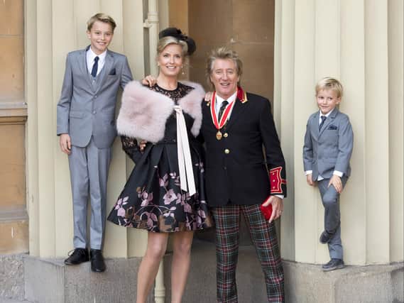 Sir Rod Stewart  with his wife, Penny Lancaster and children Alastair and Aiden after he received his knighthood in recognition of his services to music and charity at Buckingham Palace on October 11, 2016 in London, England. (Photo by David Parker - WPA Pool/Getty Images)