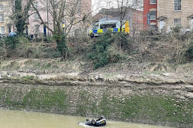 The scene in the Bedminster area of Bristol after a car went through railings and into the River Avon. Picture: PA
