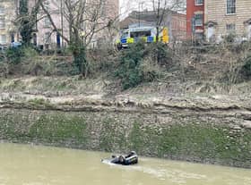 The scene in the Bedminster area of Bristol after a car went through railings and into the River Avon. Picture: PA