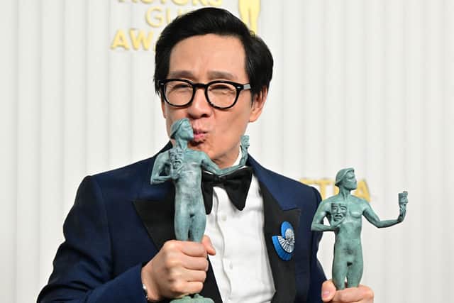 US-Vietnamese actor Ke Huy Quan poses with the awards for outstanding Male Actor in a Supporting Role - Motion Picture and Outstanding Performance by a Cast in a Motion Picture for "Everything Everywhere All at Once" during the 29th Screen Actors Guild Awards at the Fairmont Century Plaza in Century City, California, on February 26, 2023. (Photo by Frederic J. Brown / AFP) (Photo by FREDERIC J. BROWN/AFP via Getty Images)