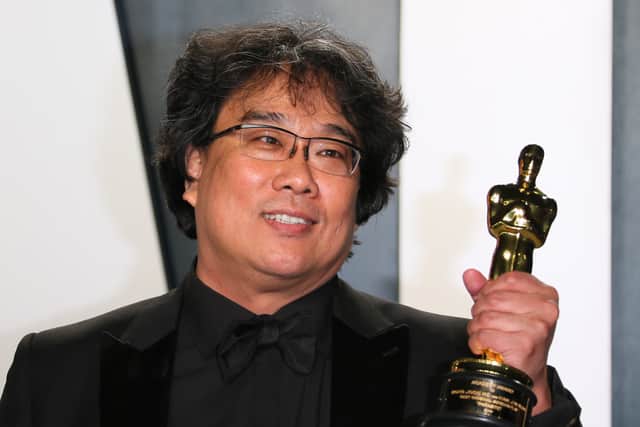 South Korean director Bong Joon-ho poses with the Oscar for Best Screenplay for "Parasite" as he attends the 2020 Vanity Fair Oscar Party following the 92nd Oscars at The Wallis Annenberg Center for the Performing Arts in Beverly Hills on February 9, 2020. (Photo by Jean-Baptiste Lacroix / AFP) (Photo by JEAN-BAPTISTE LACROIX/AFP via Getty Images)