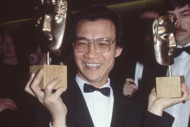 Dr Haing S Ngor (1940 - 1996), the Cambodian star of 'The Killing Fields', at a BAFTA ceremony at the Grosvenor House Hotel, London, holding his awards for Best Actor and Best Outstanding Newcomer. He was shot to death at his Los Angeles home in February 1996.  (Photo by Hulton Archive/Getty Images)