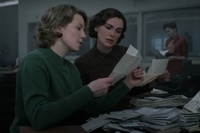 Carrie Coon as Jean Cole and Keira Knightley as Loretta McLaughlin in Boston Strangler, sifting through old letters (Credit: Claire Folger/20th Century Studios)