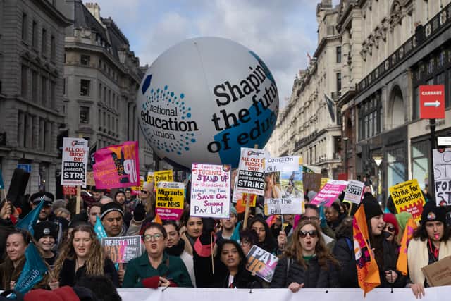 Education workers rally towards Westminster during a day of strikes across the UK on 1 February 2023 in London
