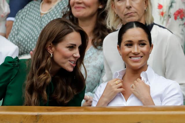 Britain’s Catherine (L), Duchess of Cambridge and Britain’s Meghan, Duchess of Sussex, watch Romania’s Simona Halep playing US player Serena Williams during their women’s singles final on day twelve of the 2019 Wimbledon Championships at The All England Lawn Tennis Club in Wimbledon, southwest London, on July 13, 2019. (Credit: BEN CURTIS/AFP via Getty Images)
