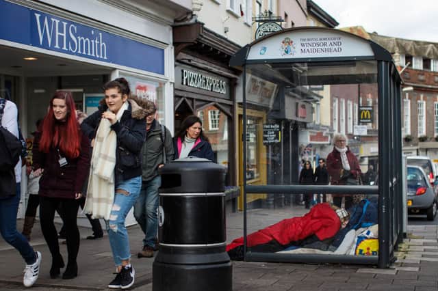 A person sleeps rough in a bus shelter outside Windsor Castle. Credit: Getty Images