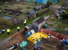 A police search team works through an allotment area as they continue to search for the missing baby in Brighton (Photo by Leon Neal/Getty Images).
