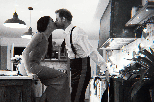 Harry and Meghan kiss in the kitchen at Frogmore Cottage (Photo: Netflix)