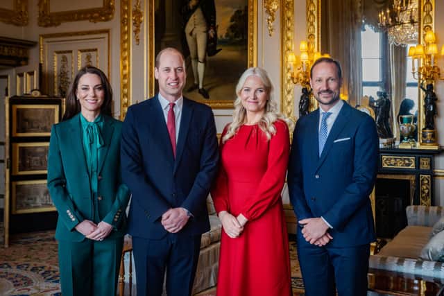 Kate Middleton wore a green Burberry trouser suit to meet the Crown Prince Haakon of Norway and Crown Princess Mette-Marit of Norway. Photo by Getty

