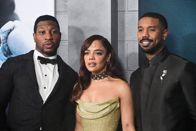 (L-R) Actor Jonathan Majors, actress Tessa Thompson, and actor-director-producer Michael B. Jordan arrive for the Los Angeles premiere of Creed III at the TCL Chinese Theater in Hollywood, California, on February 27, 2023. (Photo by Robyn BECK / AFP)