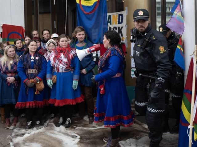 President of the Sami Parliament, Silje Karine Muotka, delivers a speech to activists as they blocked Norway’s Ministry of Finances to protest wind turbines built on traditional reindeer-herding land (Photo by OLIVIER MORIN/AFP via Getty Images)