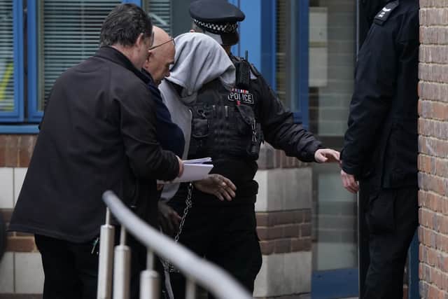 Mark Gordon is led into Crawley Police Station before being taken to Crawley Magistrates Court (Photo: PA)