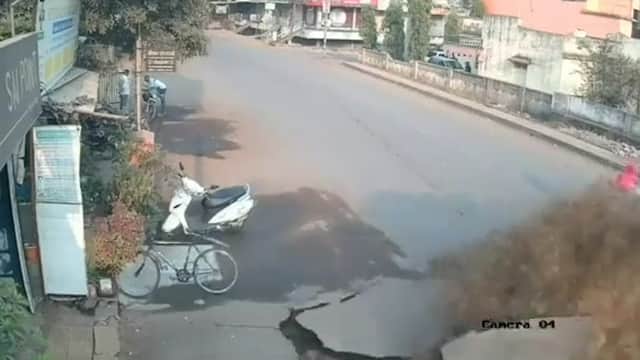 Harrowing moment road explodes in India. Picture: SWNS