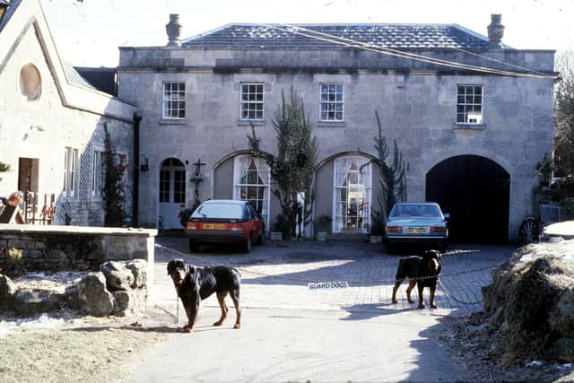 John Palmer’s dogs Brinks and Matt outside his former estate near Bath. Picture: SWNS