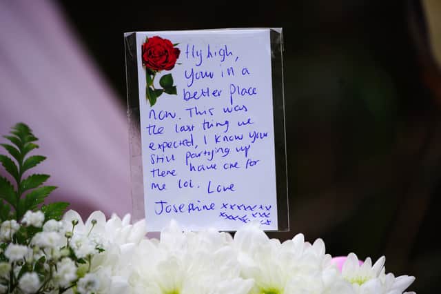 A message left with floral tributes left near the scene in the St Mellons area of Cardiff (Image: PA)
