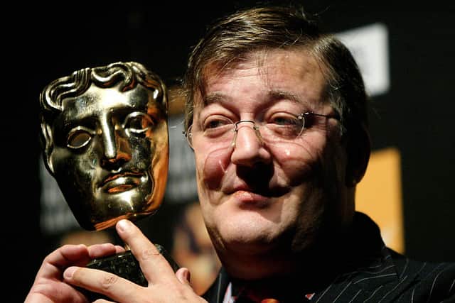 British comedian and filmmaker Stephen Fry announces the nominations for the Orange British Academy Film Awards (BAFTA) in London, 19 January 2004 (Photo credit: NICOLAS ASFOURI/AFP via Getty Images)