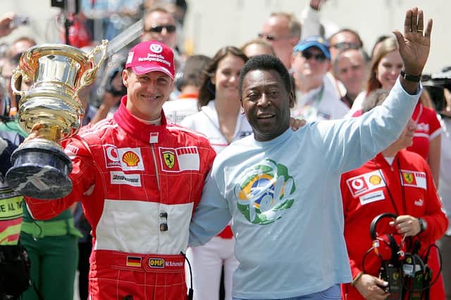 Pele awards Schumacher a trophy following his last race for Ferrari in F1 in 2006
