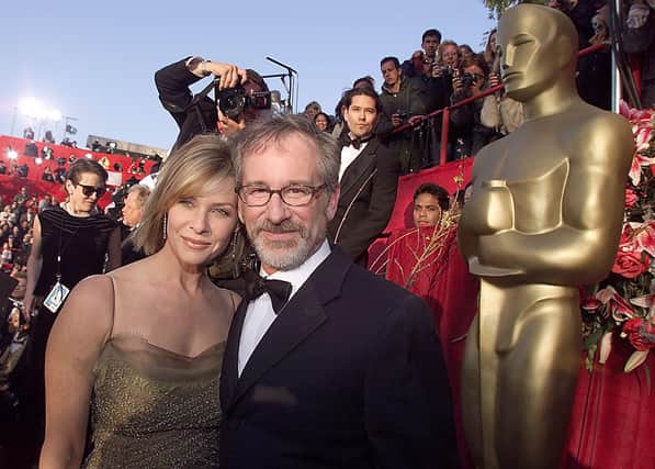  Steven Spelberg,  Oscar nominee for Best Director for “Saving Private Ryan”, and his wife Kate Capshaw arrive 21 March 1999  at the Dorothy Chandler Pavilion in Los Angeles, CA for the 71st Annual Academy Awards.  (Credit: LUCY NICHOLSON/AFP via Getty Images)