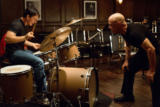 Miles Teller as Andrew Neiman and J. K. Simmons as Terence Fletcher in Whiplash, yelling during a practice session (Credit: Daniel McFadden/Sony Pictures Classics)