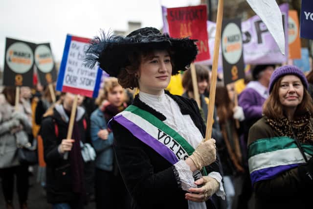 The three colours used to represent International Women’s Day, purple, green and white, have links to suffragettes.