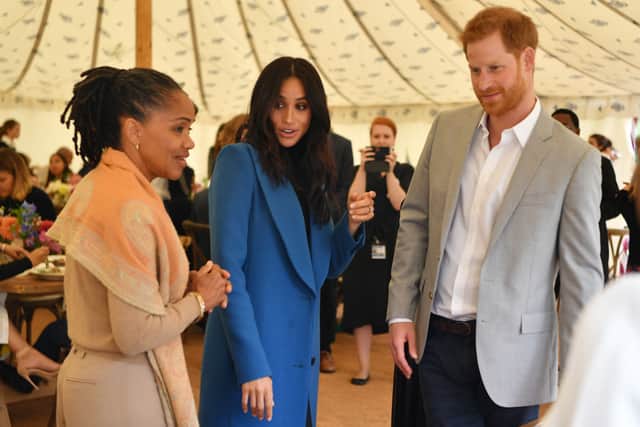 Meghan, Duchess of Sussex accompanied her mother Doria Ragland and Prince Harry, Duke of Sussex for an event to mark the launch of a cookbook with recipes from a group of women affected by the Grenfell Tower fire at Kensington Palace on September 20, 2018 in London, England. (Photo by Ben Stansall - WPA Pool/Getty Images)