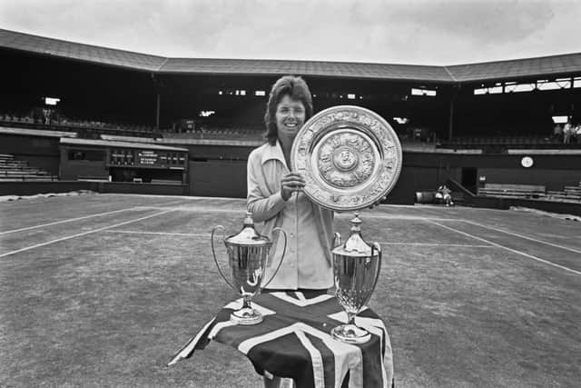Billie Jean King celebrates with her Wimbledon trophies in 1973