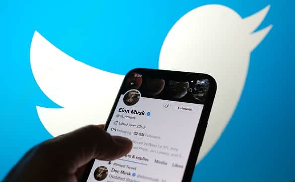 Elon Musks Twitter account with a Twitter logo in the background in Los Angeles. (AFP via Getty Images)