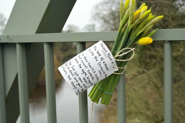 Flowers and a message tied to a bridge over the River Wyre after police recovered Nicola’s body (Photo: PA)