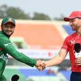 Buttler (R) shakes hands with Al Hasan ahead of T20 series