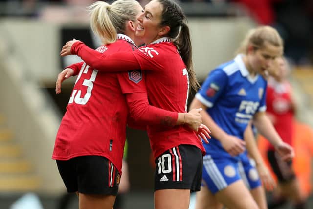 Alessia Russo celebrates her third goal with United captain Katie Zelem