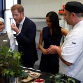 Meghan Markle and Prince Harry trying out ingredients at Mission Australia social enterprise restaurant Charcoal Lane in Australia in 2018. I wonder what Meghan chose for her lunch at Gracias Madre. Photograph by Getty