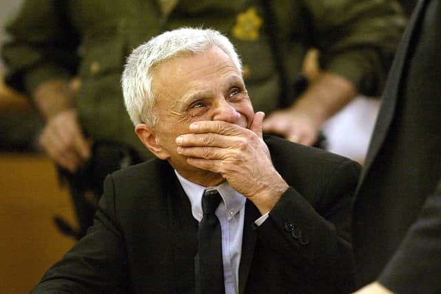 Actor Robert Blake reacts after being found not guilty of murdering his wife, Bonny Lee Bakley, at the Van Nuys Courthouse March 16, 2005 in Van Nuys, California. (Photo by Nick Ut-Pool/Getty Images)