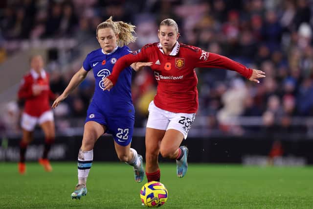 Alessia Russo of Manchester United is challenged by Erin Cuthbert of Chelsea. Picture: Nathan Stirk/Getty Images