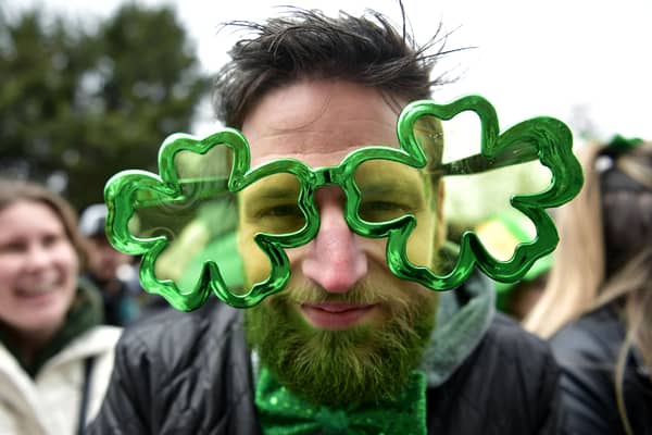 A man wears cloverleaf glasses during a St Patrick's Day parade in Dublin