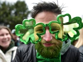 A man wears cloverleaf glasses during the St Patrick's Day parade on March 17, 2022 in Dublin, Ireland.