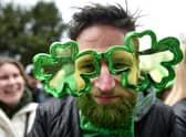 A man wears cloverleaf glasses during the St Patrick's Day parade on March 17, 2022 in Dublin, Ireland.