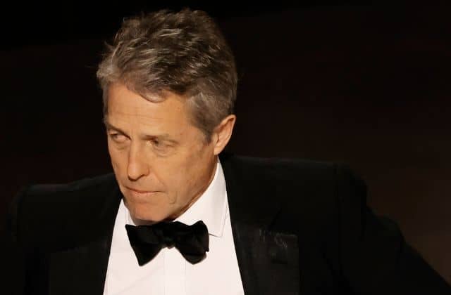 Hugh Grant speaks onstage during the 95th Annual Academy Awards at Dolby Theatre (Getty)