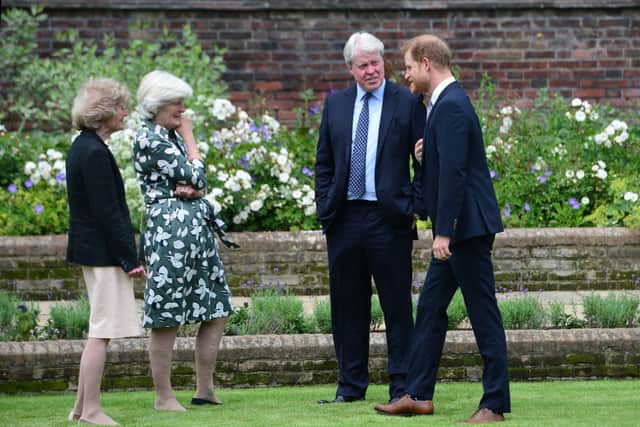  Lady Sarah McCorquodale, Lady Jane Fellowes and Earl Spencer, with their nephew Prince Harry, Duke of Sussex during the unveiling of a statue of Diana, Princess of Wales, in the Sunken Garden at Kensington Palace, on what would have been her 60th birthday on July 1, 2021 in London, England. Today would have been the 60th birthday of Princess Diana, who died in 1997. At a ceremony here today, her sons Prince William and Prince Harry, the Duke of Cambridge and the Duke of Sussex respectively, will unveil a statue in her memory. (Photo by Dominic Lipinski - WPA Pool/Getty Images)