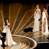  Michelle Yeoh accepts the Best Actress award for "Everything Everywhere All at Once" from Jessica Chastain and Halle Berry onstage during the 95th Annual Academy Awards at Dolby Theatre on March 12, 2023 in Hollywood, California. (Photo by Kevin Winter/Getty Images)