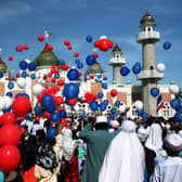 Thai Muslims release hundred of balloons after a morning prayer marking the start of the Islamic feast of Eid al-fitr outside Pattani mosque on October 13, 2007 in Pattani, Thailand.