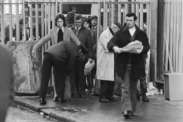 People being body searched at a gate in Belfast during the Troubles (Photo: Steve Wood/Express/Hulton Archive/Getty Images)