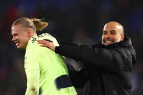 Erling Haaland and Pep Guardiola celebrate Man City’s win over Crystal Palace