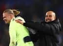 Erling Haaland and Pep Guardiola celebrate Man City’s win over Crystal Palace