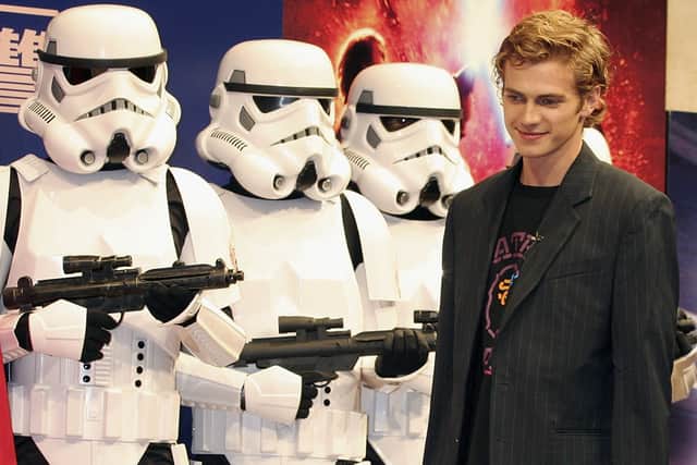 Actor Hayden Christensen stands in front of stormtroopers during a photocall to promote the film “Star Wars: Episode III - Revenge Of The Sith” July 6, 2005 in Tokyo, Japan.  (Photo by Junko Kimura/Getty Images)