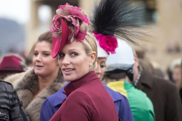 Zara Phillips watches the horses in the parade ring on Ladies Day at the Cheltenham Racecourse