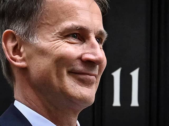 Britain’s Chancellor of the Exchequer Jeremy Hunt poses as he leaves 11 Downing Street in central London on March 15 to present the government’s annual budget to Parliament. (Photo by JUSTIN TALLIS / AFP) (Photo by JUSTIN TALLIS/AFP via Getty Images)